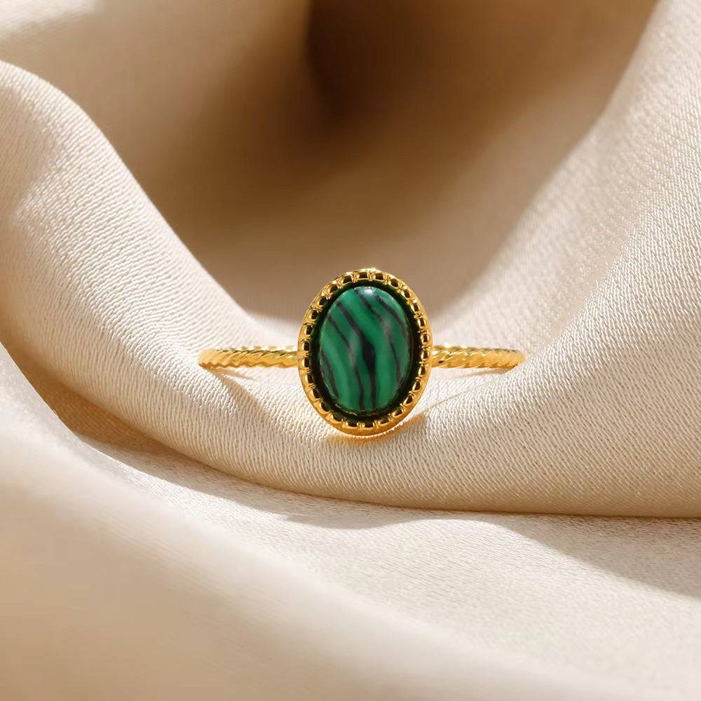 Adjustable Emerald Gaze Ring by Ainna Official featuring a vibrant emerald gemstone on a sleek band.