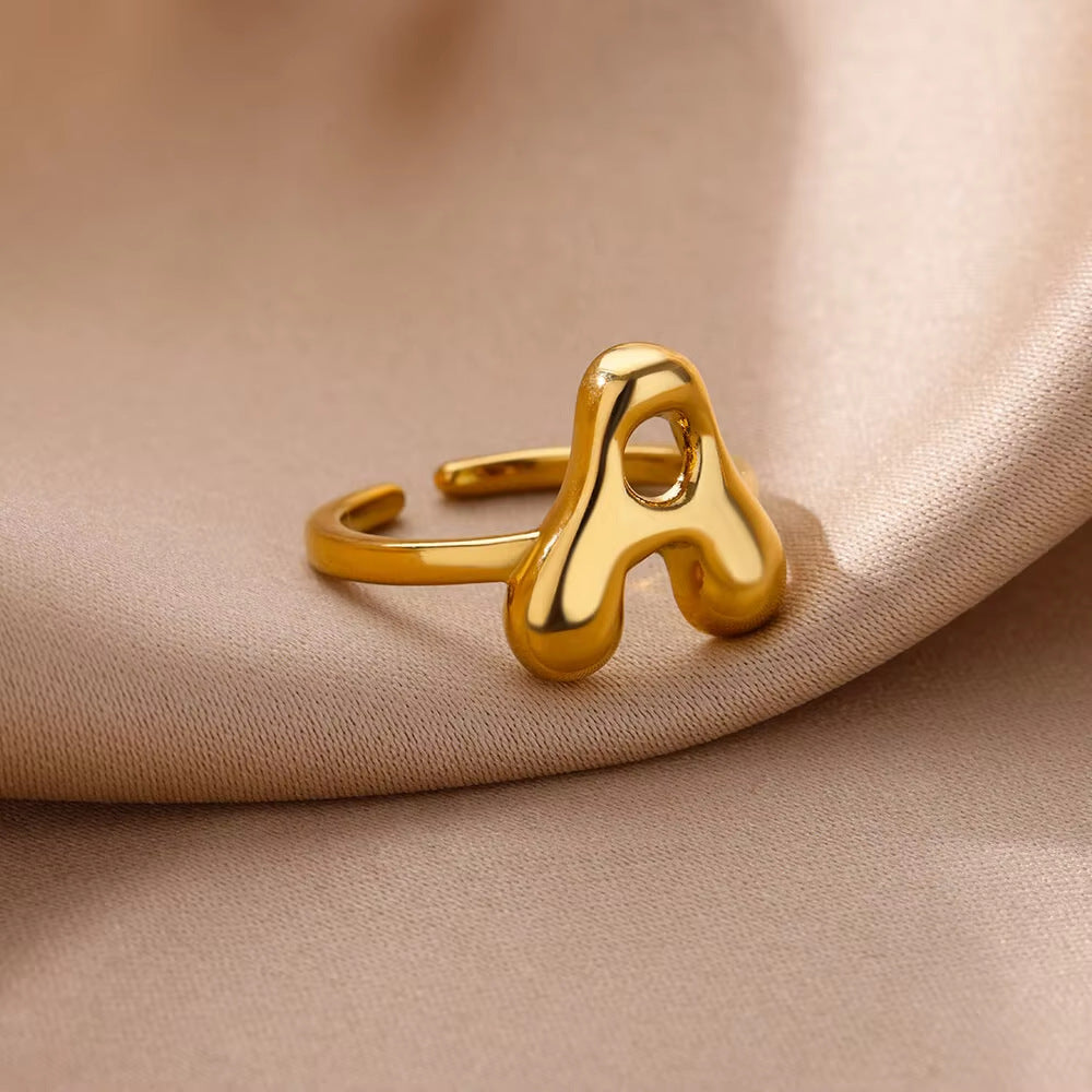 Adjustable alphabet initial ring by Ainna Official featuring a sleek, minimalist design with the letter A visible on the ring.