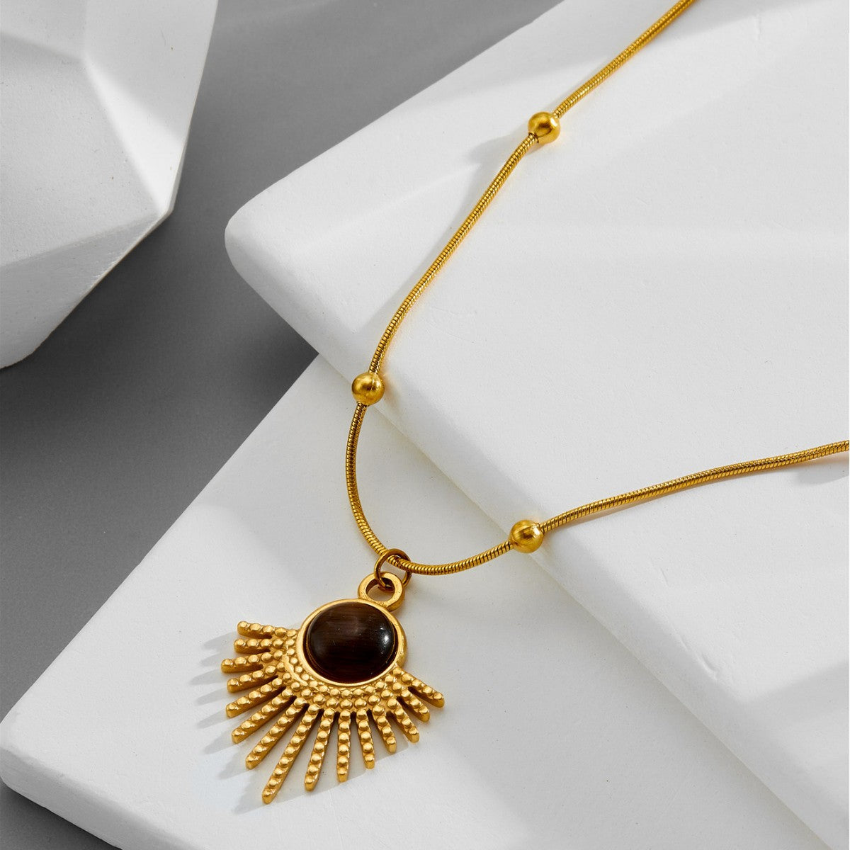 Ainna Official Noir Kai Pendant featuring a sleek black design with intricate details on a silver chain.