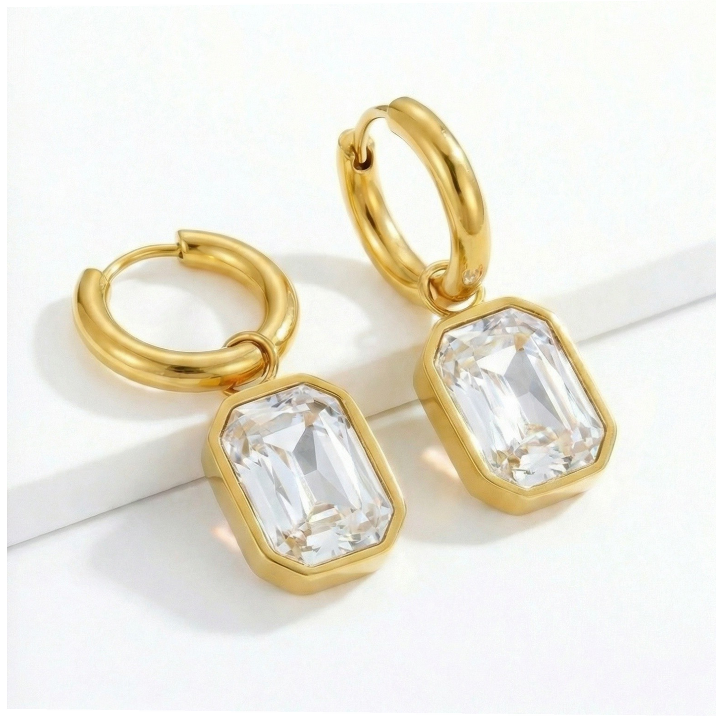 Crystal cut earrings with sparkling faceted stones, elegant jewelry piece showcasing intricate craftsmanship and vibrant shine.