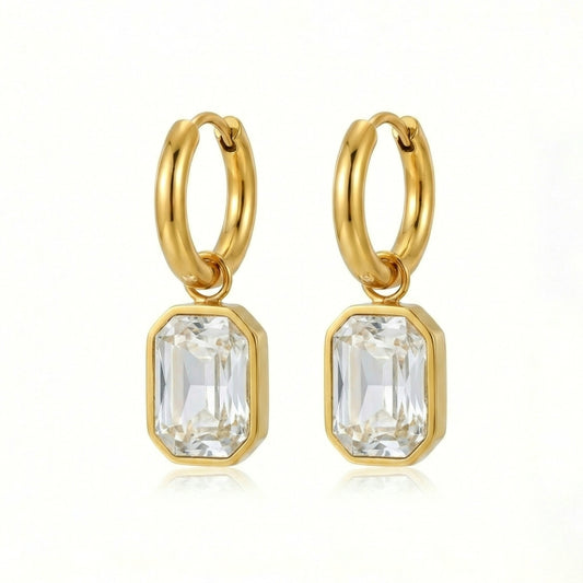 Elegant crystal cut earrings featuring sparkling faceted designs, perfect for adding a touch of sophistication.
